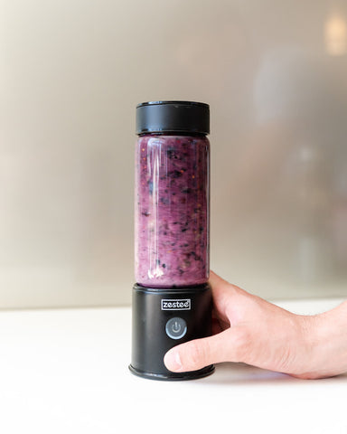 Zestee blender making a blueberry protein smoothie