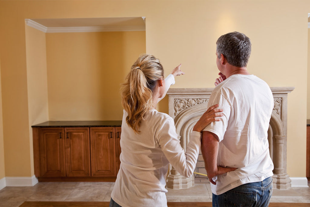 couple looks at wall