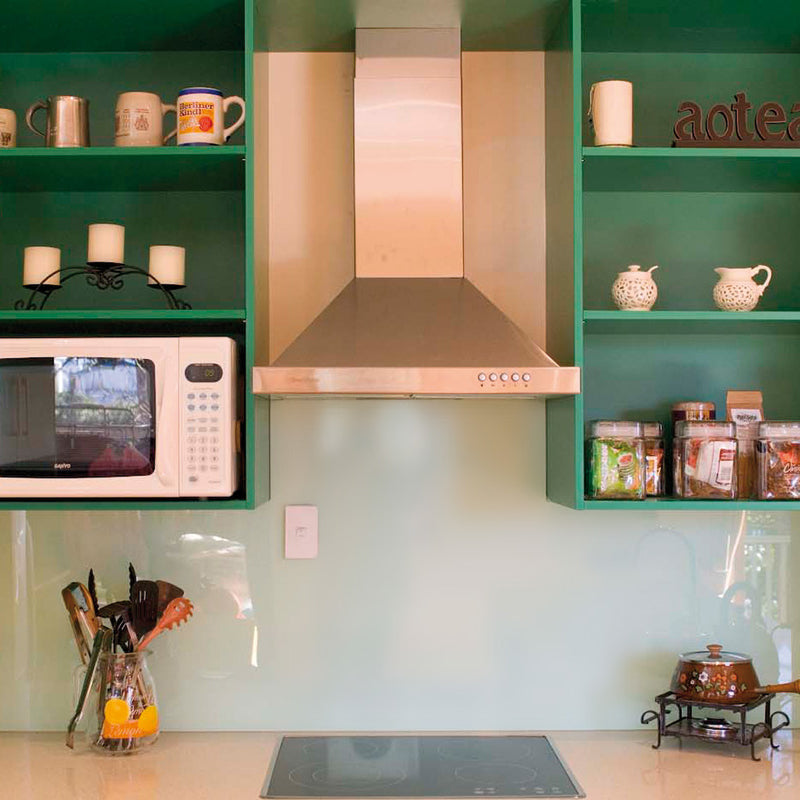 kitchen with stovetop fan and a microwave in new zealand