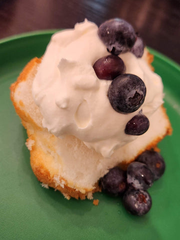 Image of angel food cake, whipped cream, and blueberries