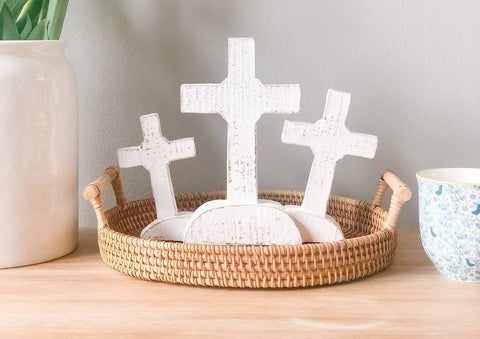 Three white crosses displayed on a tray