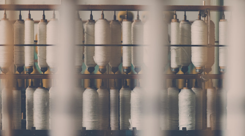 Cotton being spun on reels ready to be woven into bed linen.