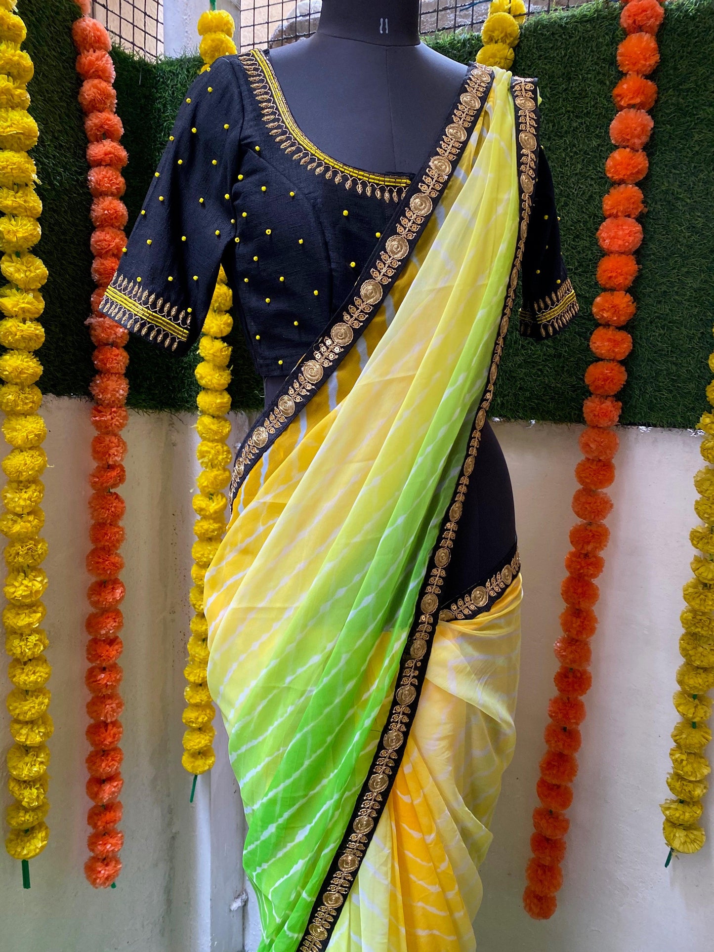 Tie and die green and yellow saree with aari work blouse