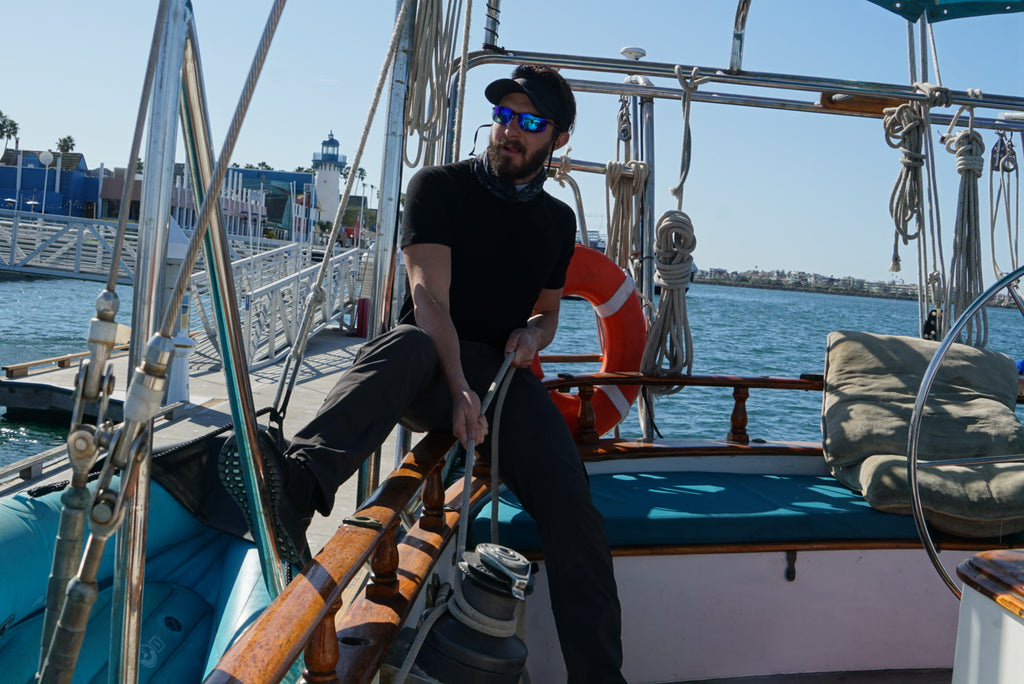 Stephen on a sailboat in merino wool