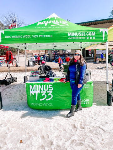 Marketing team member in front of Minus33 tent