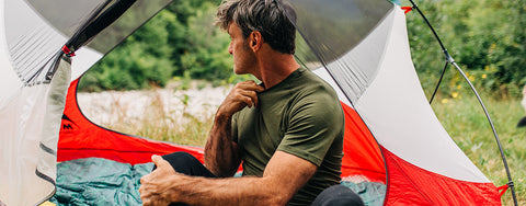 man camping wearing raglan micro weight woolverino tshirt