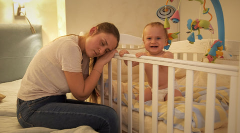 mom sleeping while baby is awake