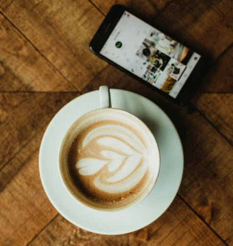 Latte and phone with instagram next to it