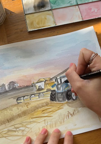 Doodling Lucy watercolour painting of New Holland tractor and combine harvester at sunset