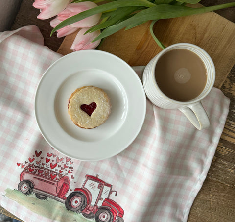 Jammie Dodger and a doodling lucy tea towel with pink tulips