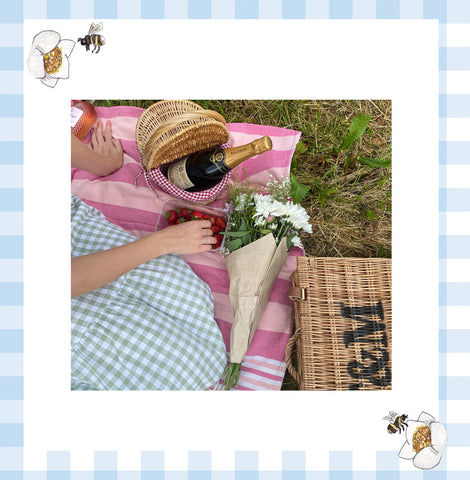 picnic blanket, english sparkling wine, flower bouquet 