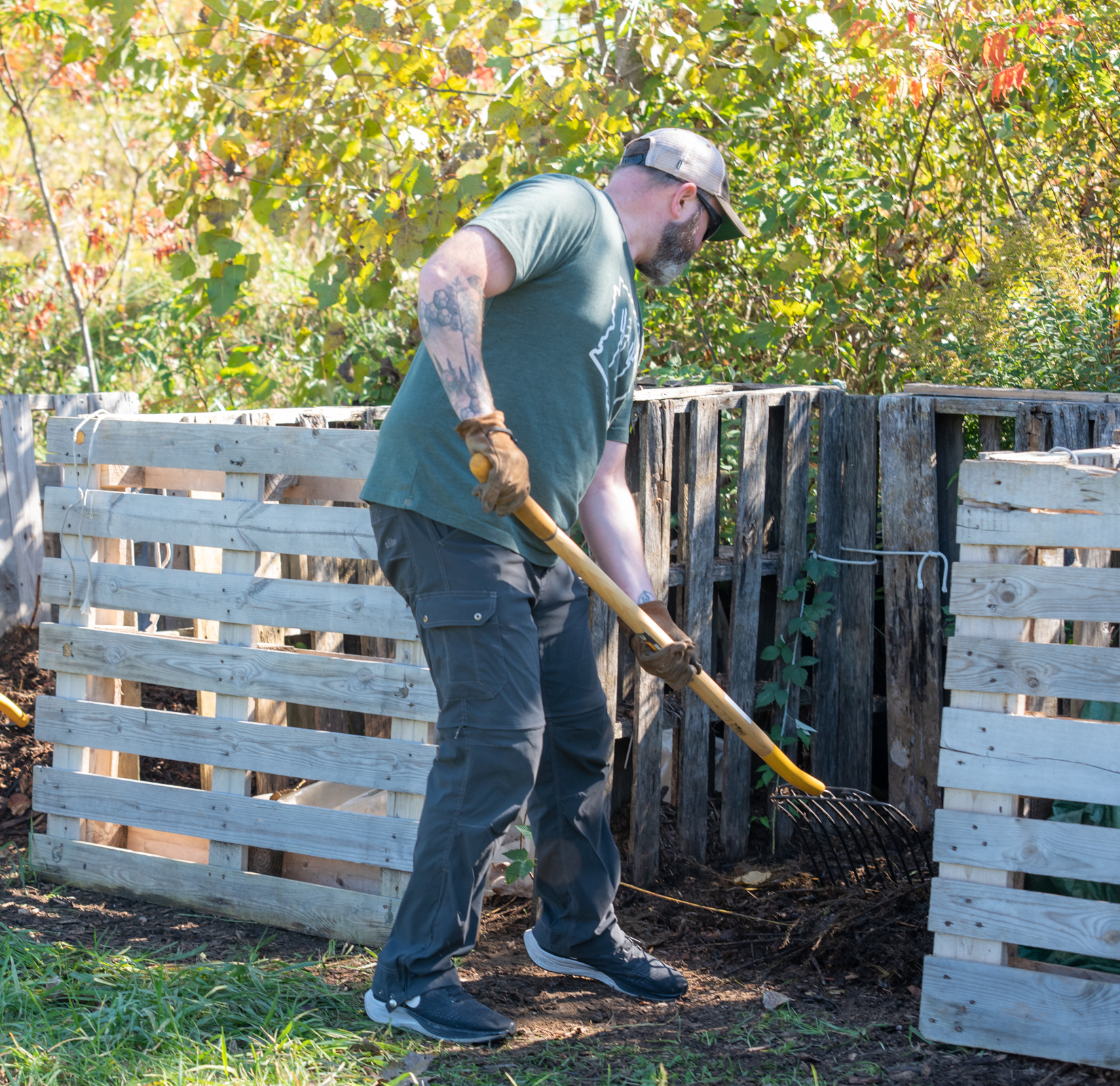 Person shovelling compost at Pott Farms