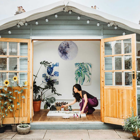 Artist Ingrid Sanchez, AKA CreativeIngrid painting modern botanical paintings in her art studio located in London. Photo: Azu Morales.