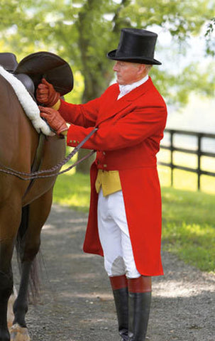 Fox hunting equestrian dressed in classic scarlet shadbelly and top hat