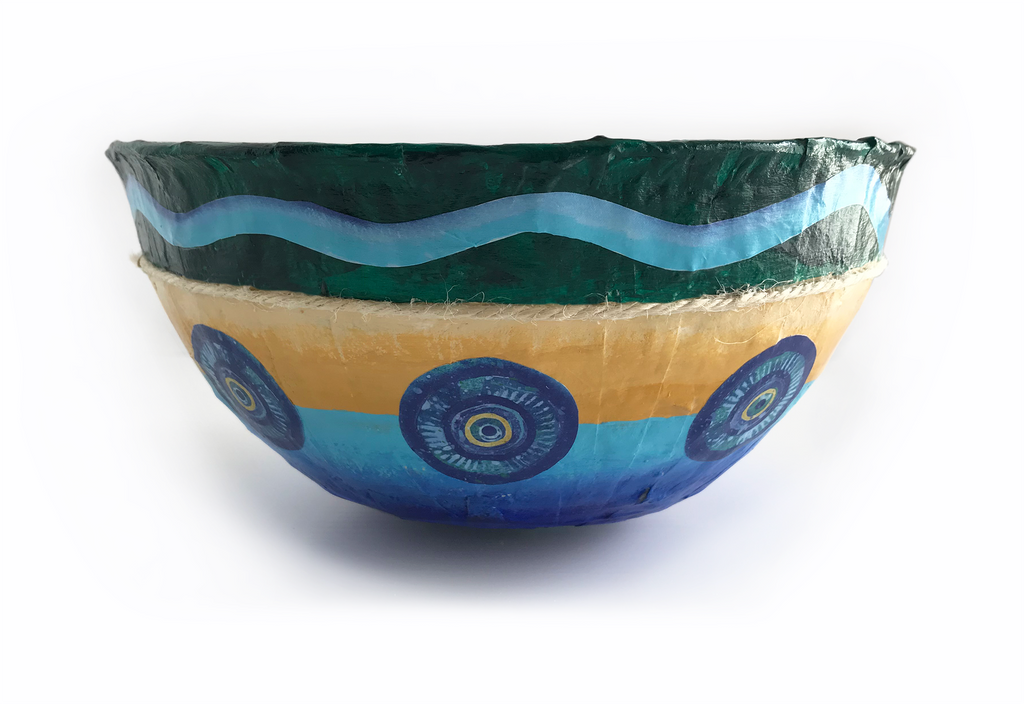 We have the ability to usher in the calmness and tranquility of the deep sea within our very own home. Coastal decor accents add that special touch that causes us to adrift for moments in time. Notice how our Paper Mache Coastal Bowls are created with a deep sea color palette and sandy beach tones. They are handmade with an irregular and imperfect paper mache surface just like the cliffs overlooking Chapman's Peak. Everything coastal makes for a restful haven both inside and out. This South African-inspired piece of coastal decor has been developed with you in mind. May you find peace and tranquility as you become purposeful with what you place in and around you. 