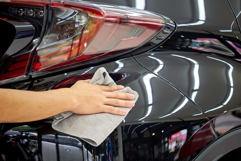 Waxing a car by hand