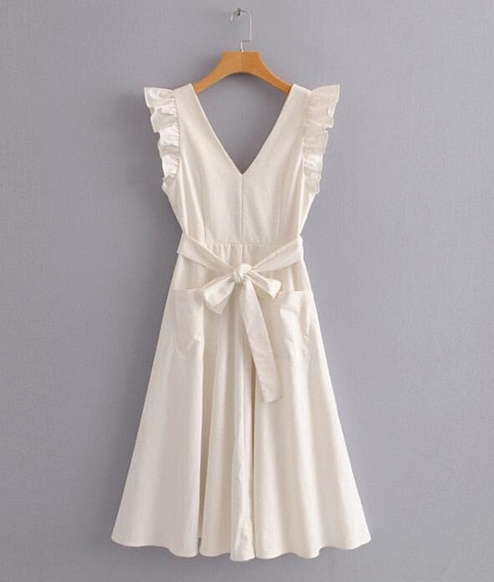 white linen dress with pockets