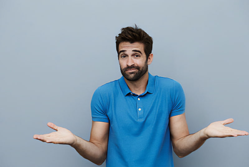 Man with hands in question pose wondering what age do men stop being sexually active