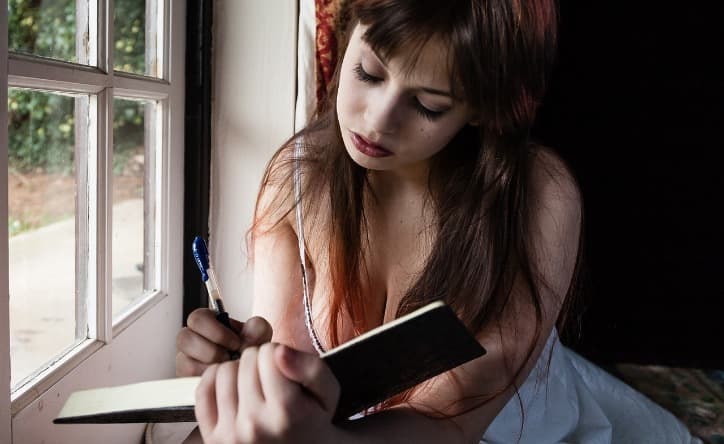 Woman Keeping a Diary of Her Sexual Fantasies
