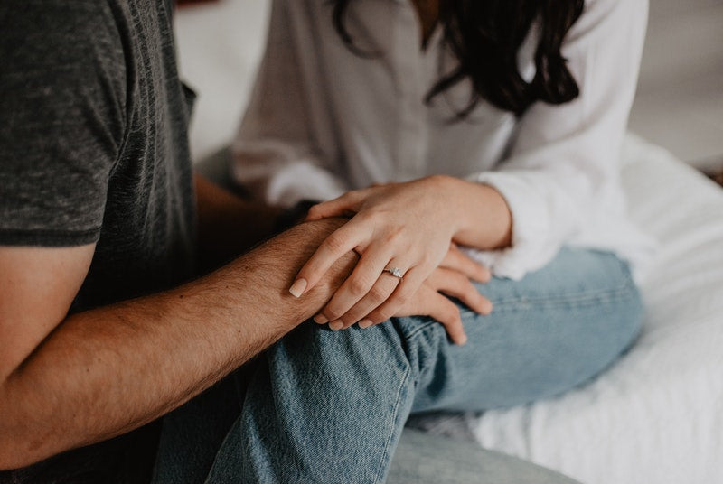 Woman comforting man that needs to take care of blue balls by himself