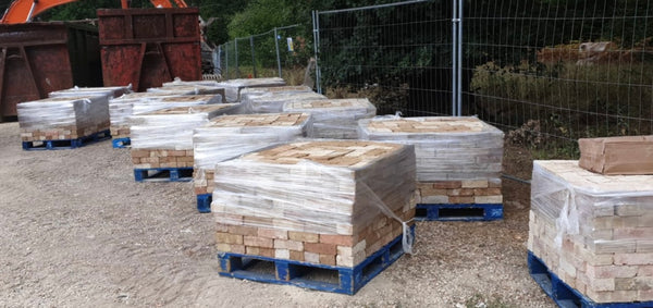 Bricks being reclaimed on demolition site