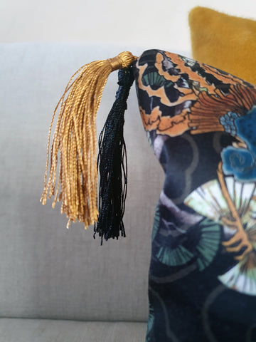 silky double tassels in gold ochre yellow and black hang delicately from the corner of the oriental double tassel cushion from Hazeldee Home