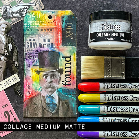 Photo from Tim Holtz dot com showing new jar of Collage Matte Medium with Idea-ology, Distress Brush and Distress Crayons