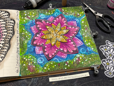 stamping and spraying in to create a waterlily pond in a Dylusions mixed media journal