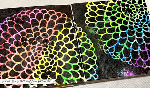 Photograph showing neon rainbow colours underneath black painted flowers using Dina Wakley MEdia Neon Scribble Sticks - Art by Jenny James, April 2024