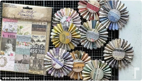 photograph from Tim TV showing Tim Holtz holding a rosette made using Idea-Ology Collage Strips and Thinlits Rosette Dies