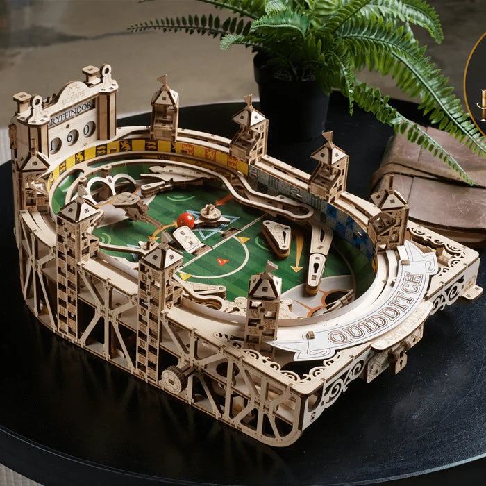 Intricate wooden gear and dial mechanism on a model globe stand.