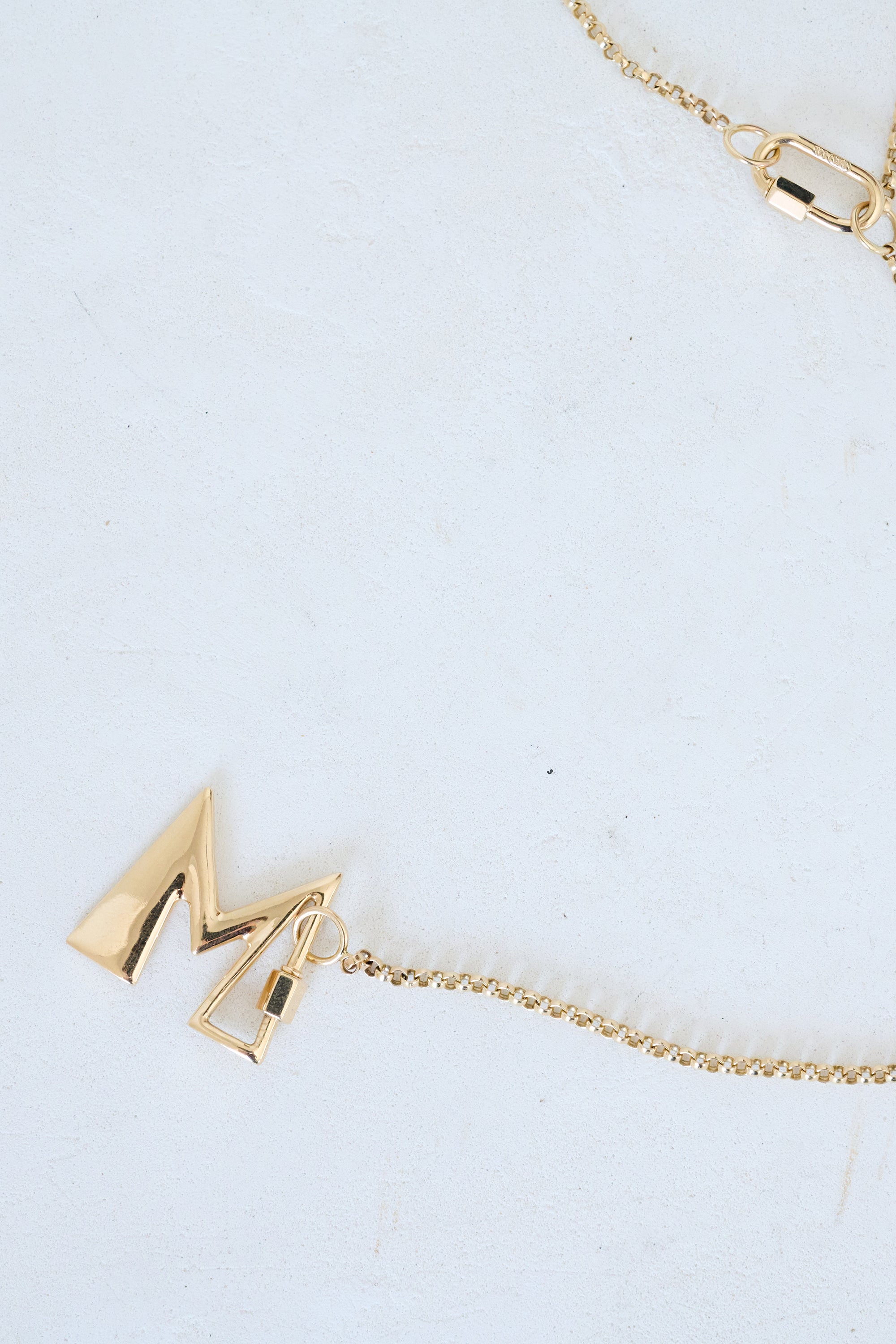Letter "M", yellow gold