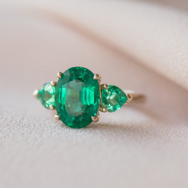 Oval Colombian Emerald with Unique Emerald Accent Stones
