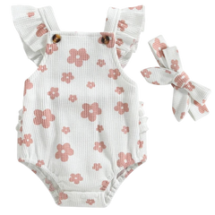 This is an image of a Little Eedie romper in white fabric with pink flowers. The cotton shows a waffle pattern and a matching headband