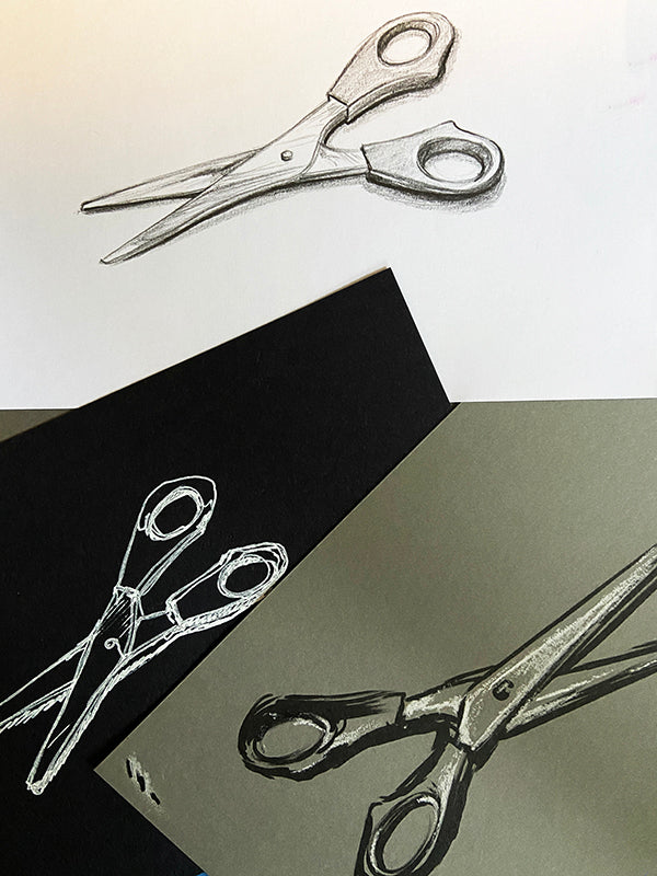 Three drawings of scissors