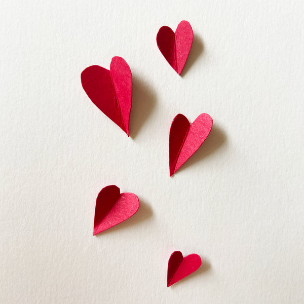 Red folded paper hearts