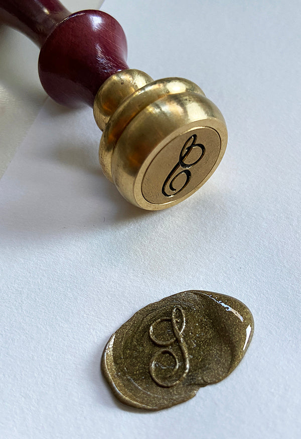 Gold wax seal with S stamp