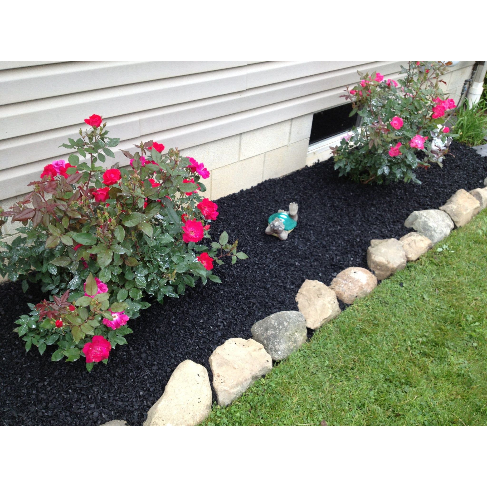 Image of Black rubber mulch in a border