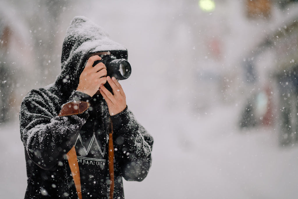 Travel Photographer with Leather Camera Strap in Snow Japan
