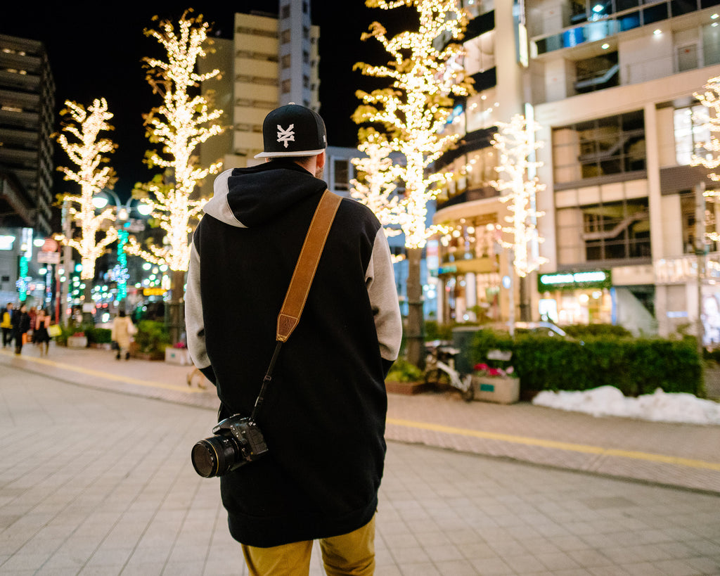 Photographer with Leather Camera Strap in Tokyo