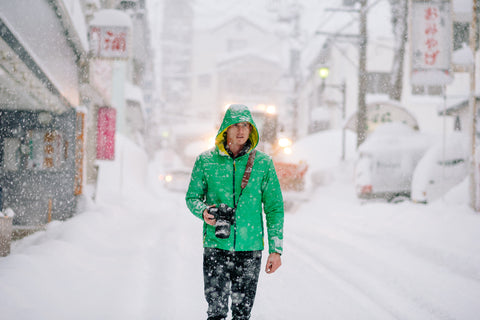 Photographer in Snow Storm with Leather Camera Strap