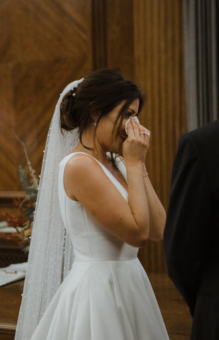 Real bride crying happy tears in pearl wedding veil by Megan therese