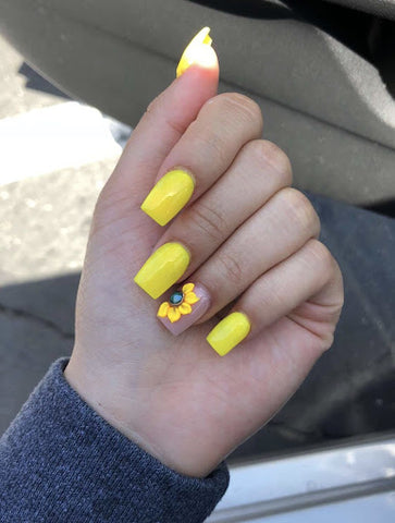 Yellow nails with a sunflower decal
