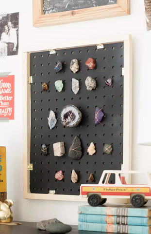 Pegboard and collection of precious stones