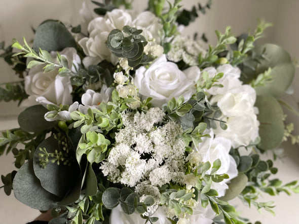 Natural white and green silk wedding bouquet with eucalyptus greenery.