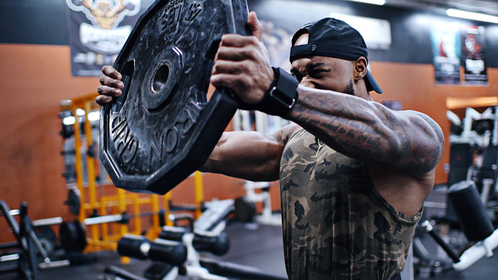 plate raises for shoulder workout