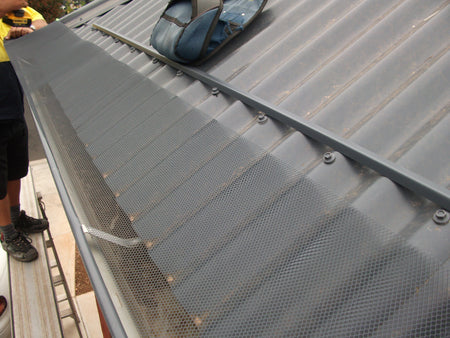 Gutter Guard Rolled out on a corrugated roof