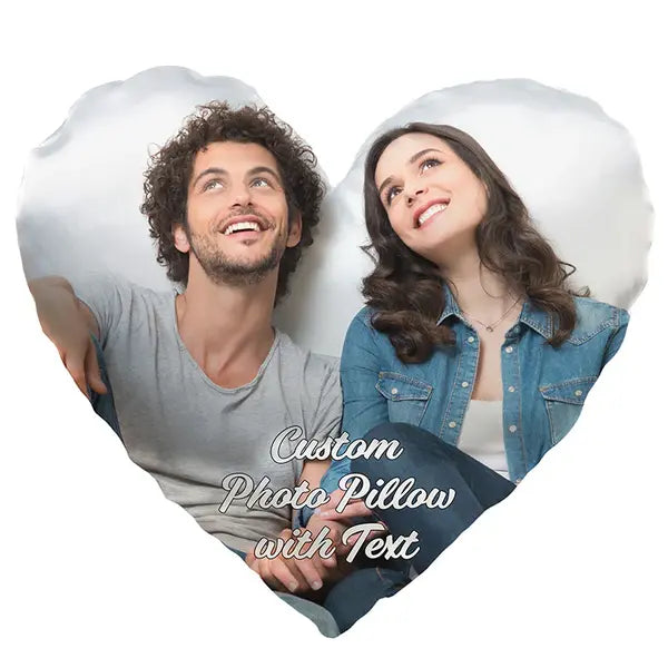 A photo of a man and woman is printed on heart shaped pillow with custom text