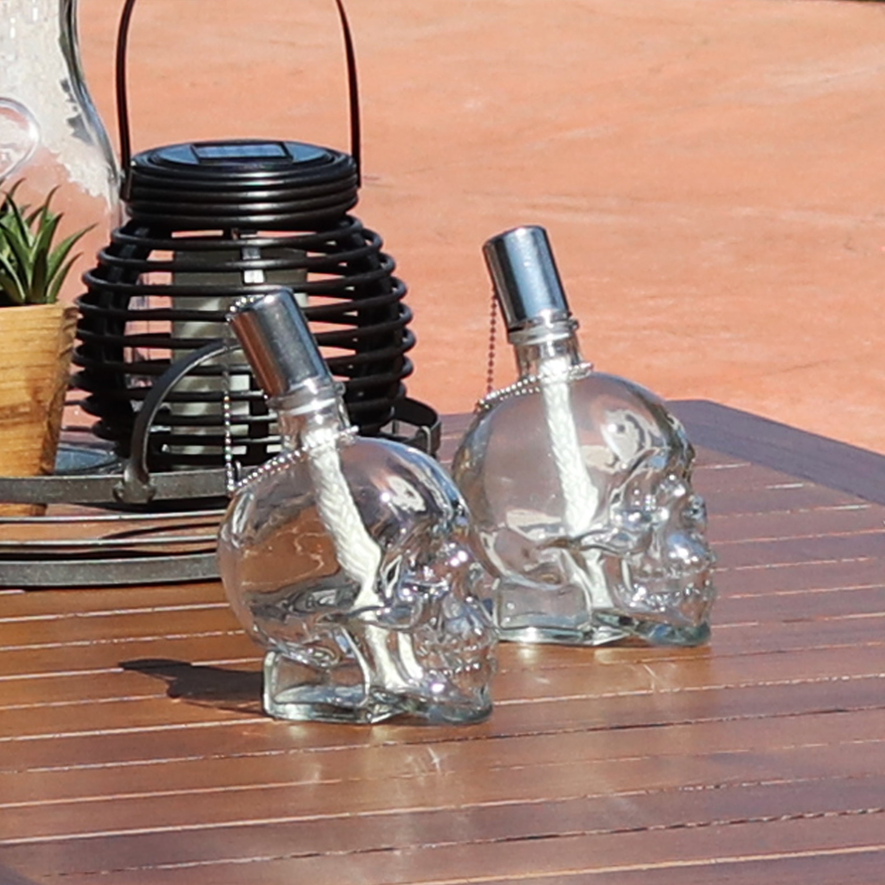 Sunnydaze Outdoor Grinning Skull Glass Tabletop Torches - 2pk