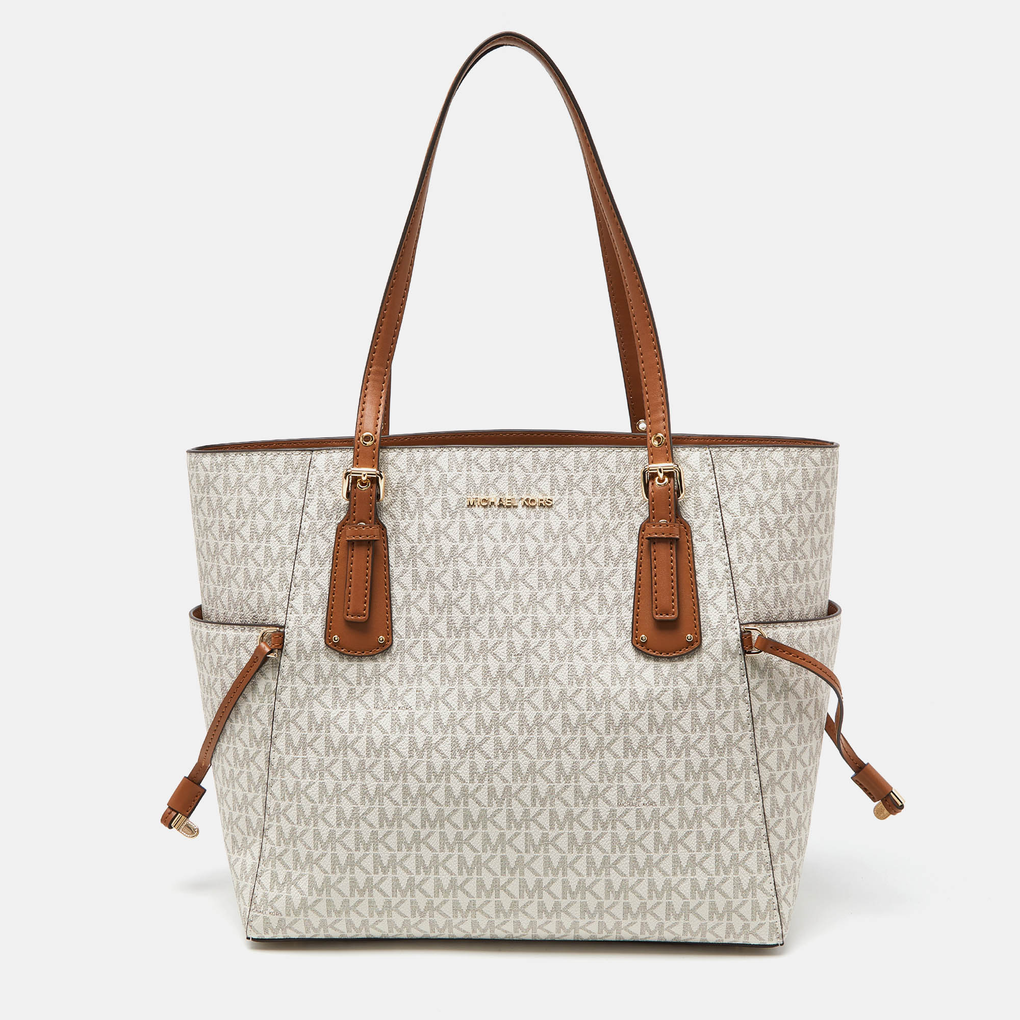 Michael Kors Cream/tan Signature Coated Canvas And Leather Voyager Tote In Beige